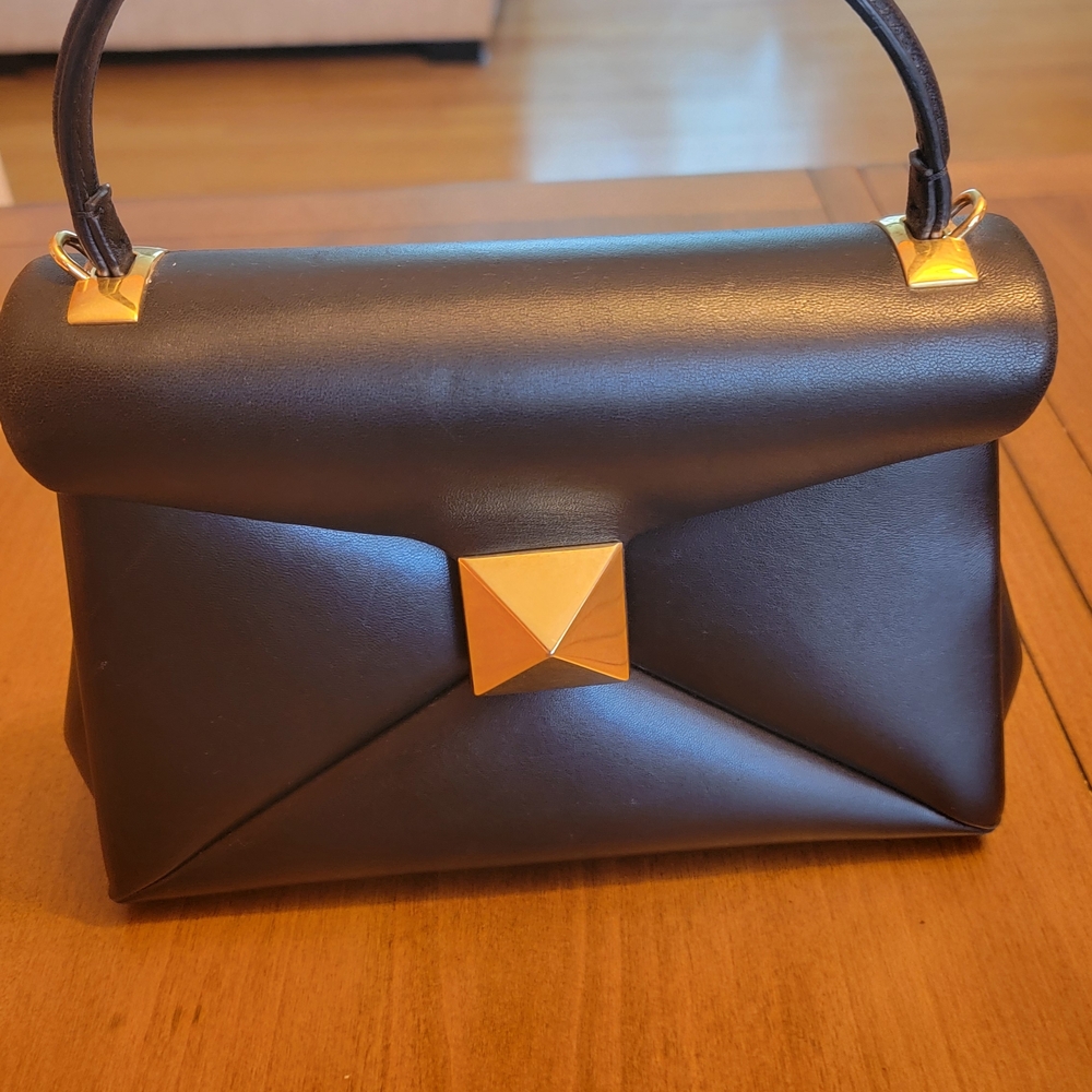 Elegant Black Handbag with Gold Accents